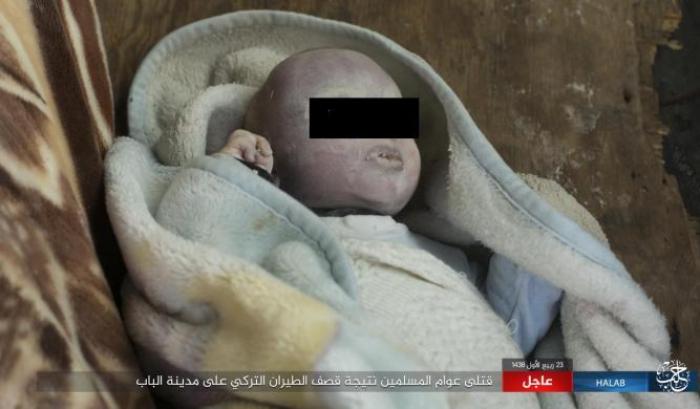 0340DA-un-bambino-morto-sotto-i-bombardamenti-turchi Un bambino morto sotto i bombardamenti turchi